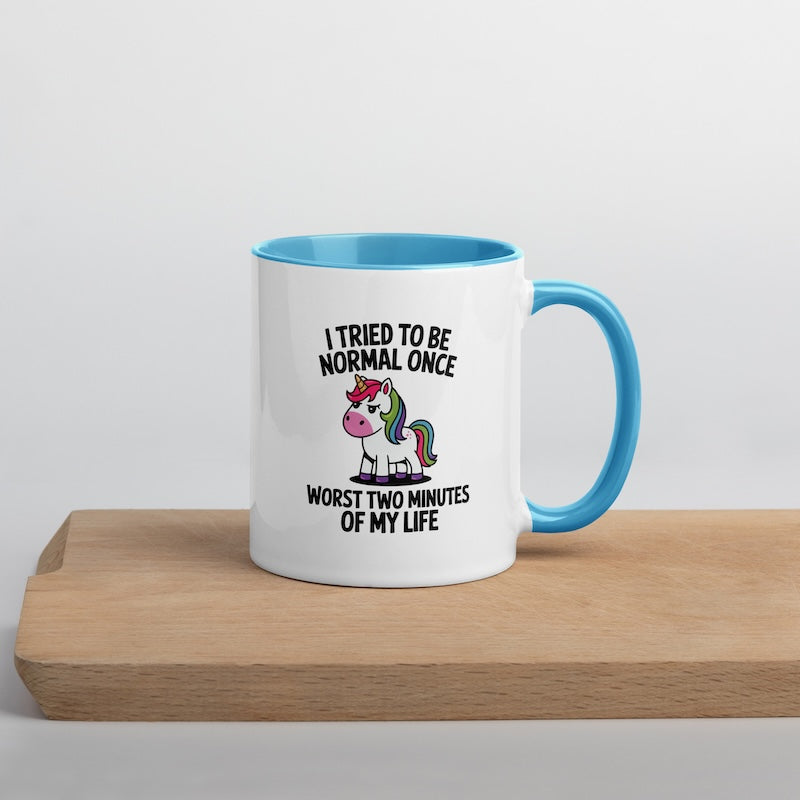 Mug with unicorn design and text on a wooden surface