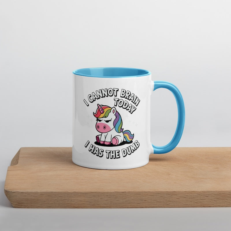 Mug with unicorn design and text on a wooden surface