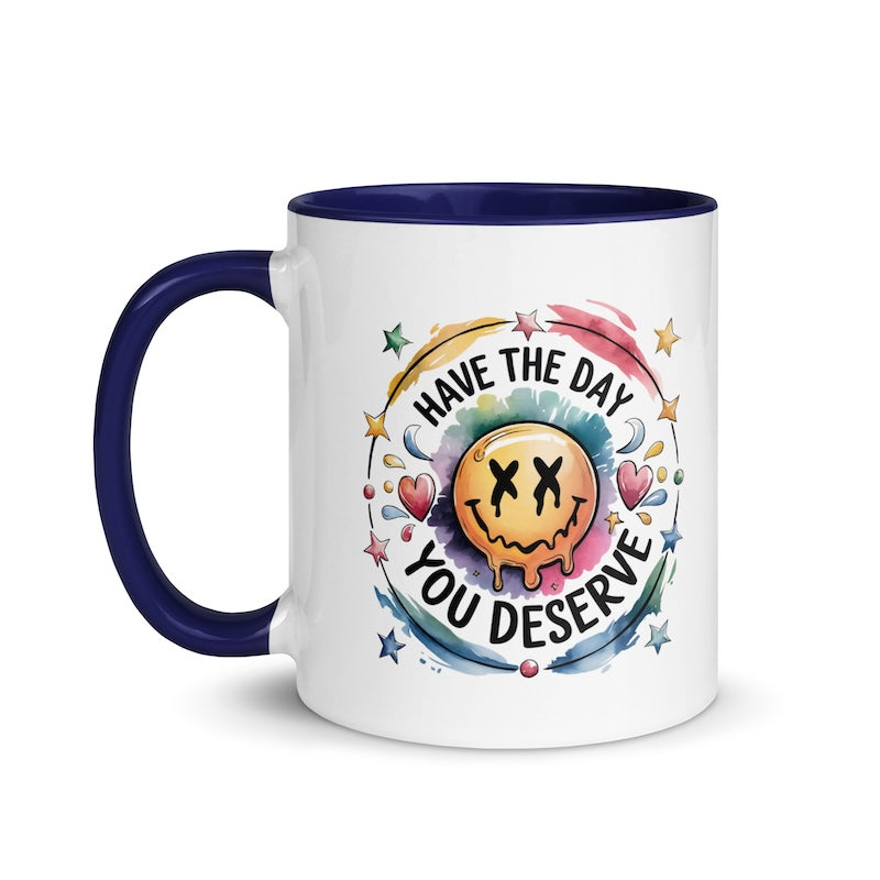 Mug with smiley face and motivational quote on a white background