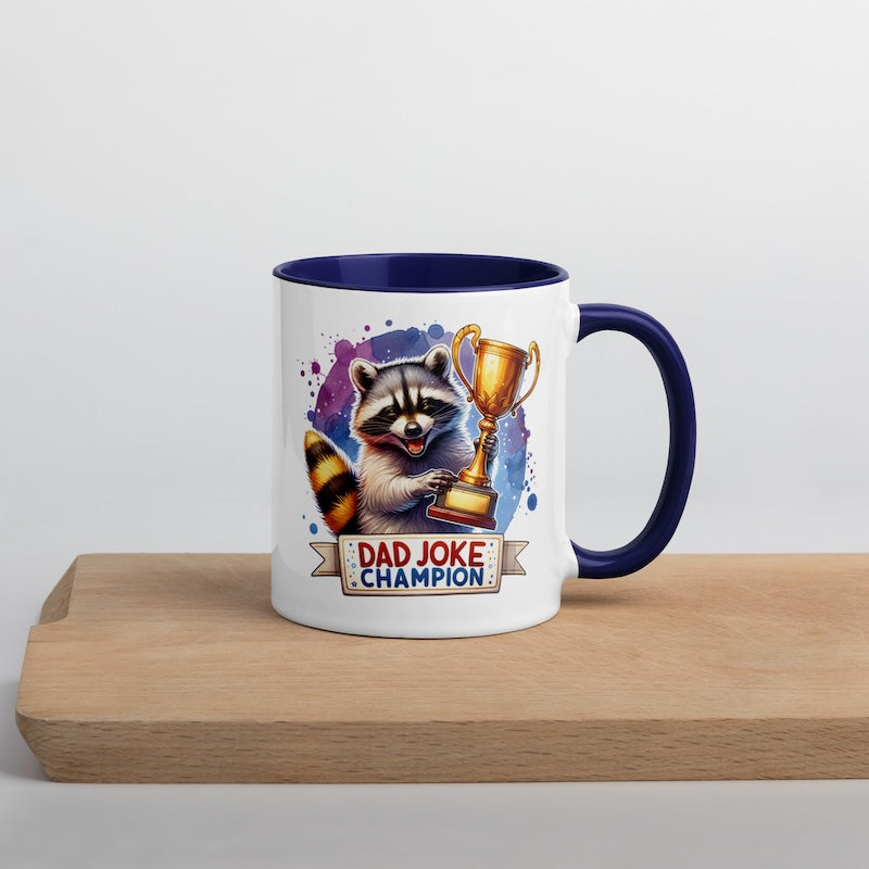 Mug with raccoon holding a trophy and 'Dad Joke Champion' text on a wooden surface.