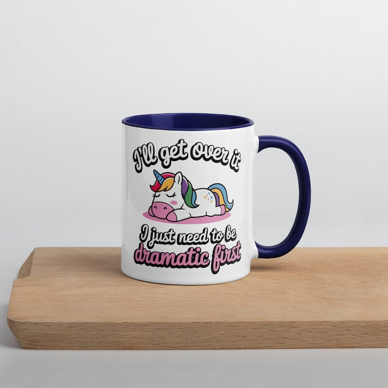 Mug with unicorn design and text on a wooden surface