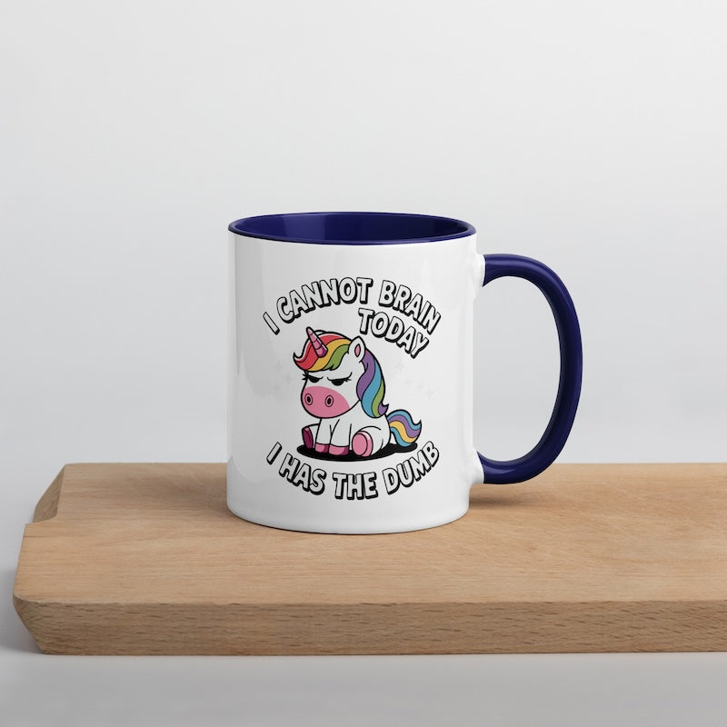 Mug with unicorn design and text on a wooden surface