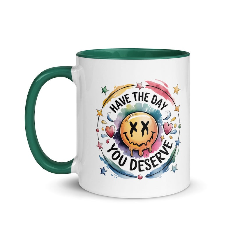 Mug with smiley face and motivational quote on a white background