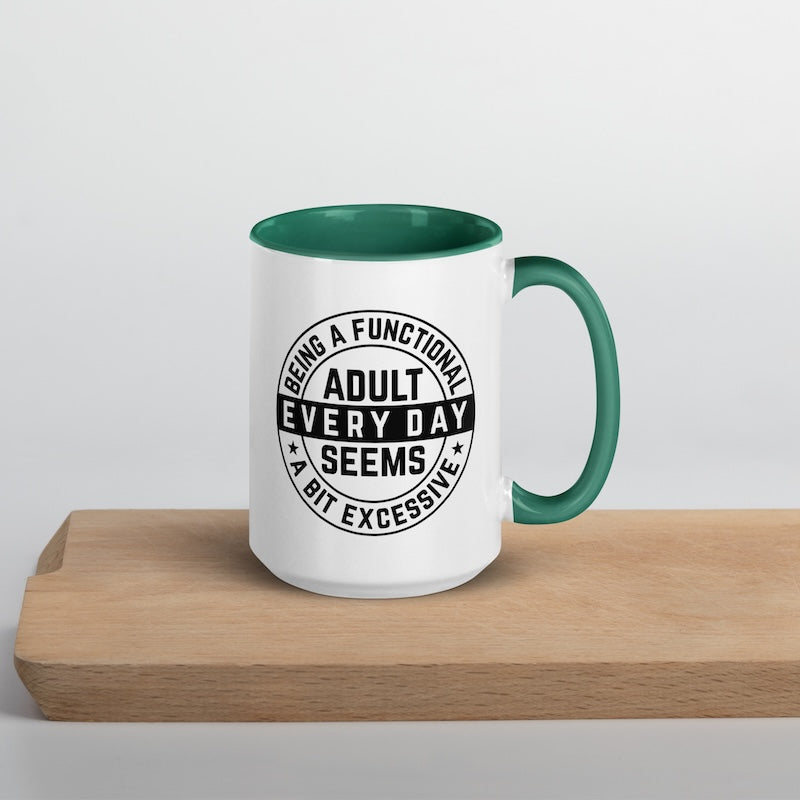 White mug with green interior and handle, featuring a black text design on a light gray background.
