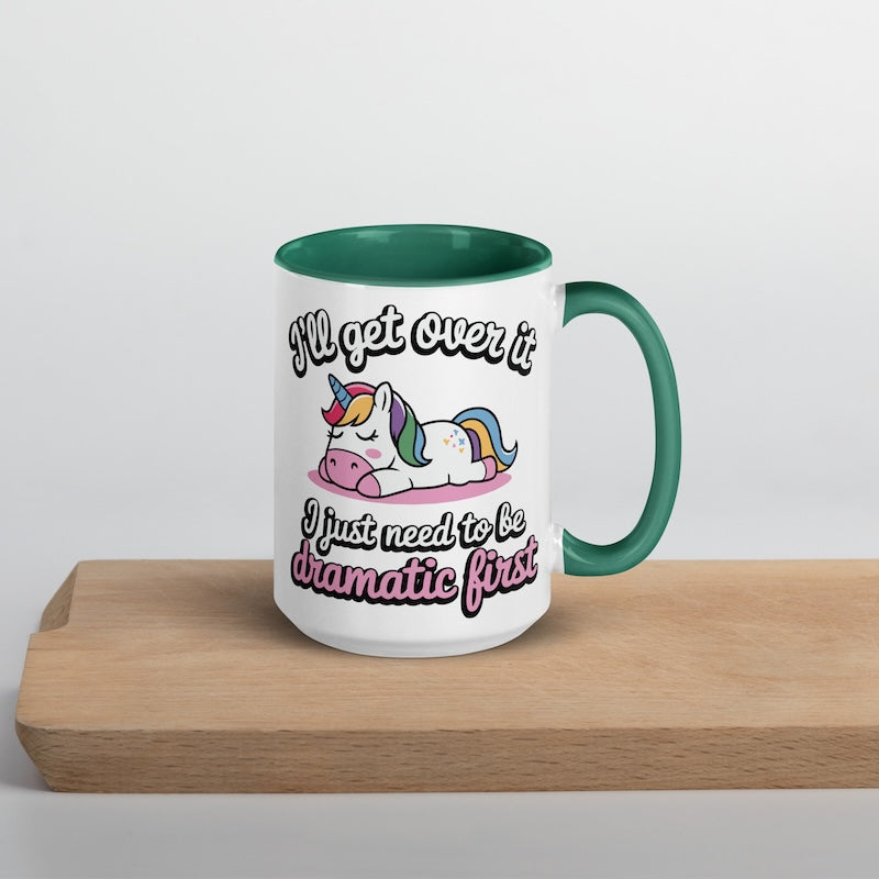 Mug with unicorn design and humorous text on a wooden surface