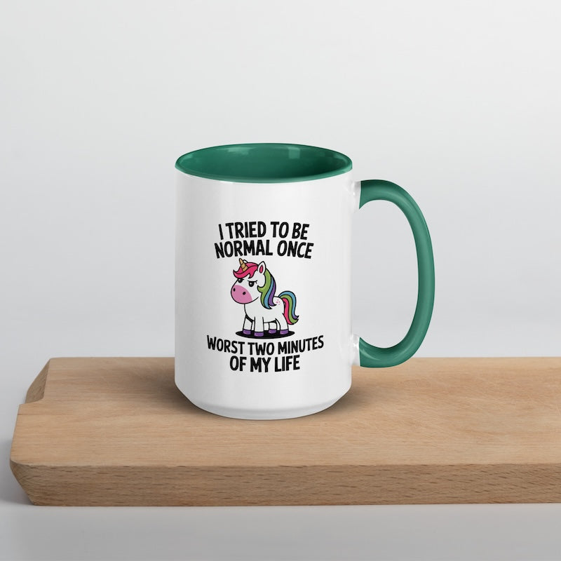 Mug with unicorn graphic and text on a wooden surface
