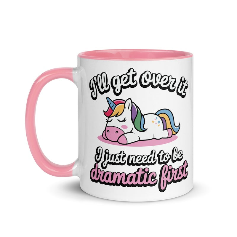 Mug with unicorn design and text 'I'll get over it, I just need to be dramatic first' on a white background