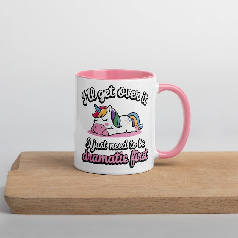Mug with unicorn design and text on a wooden surface