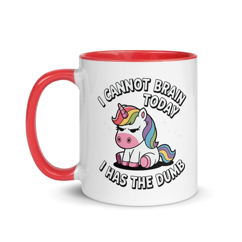 Mug with a cartoon unicorn and humorous text on a white background