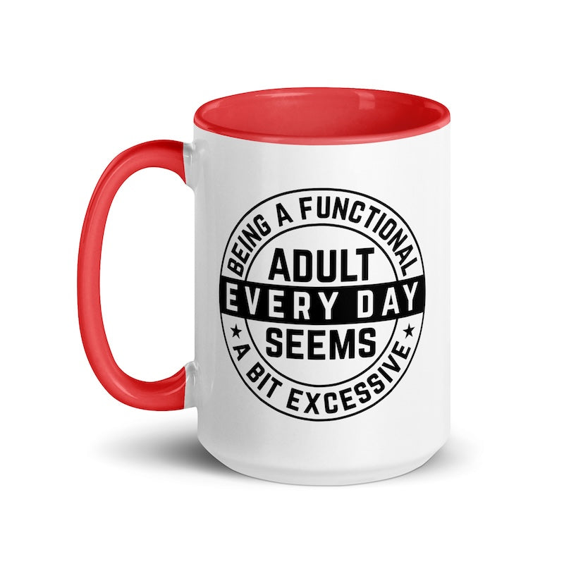 White mug with red interior and handle, featuring a black text design on a white background