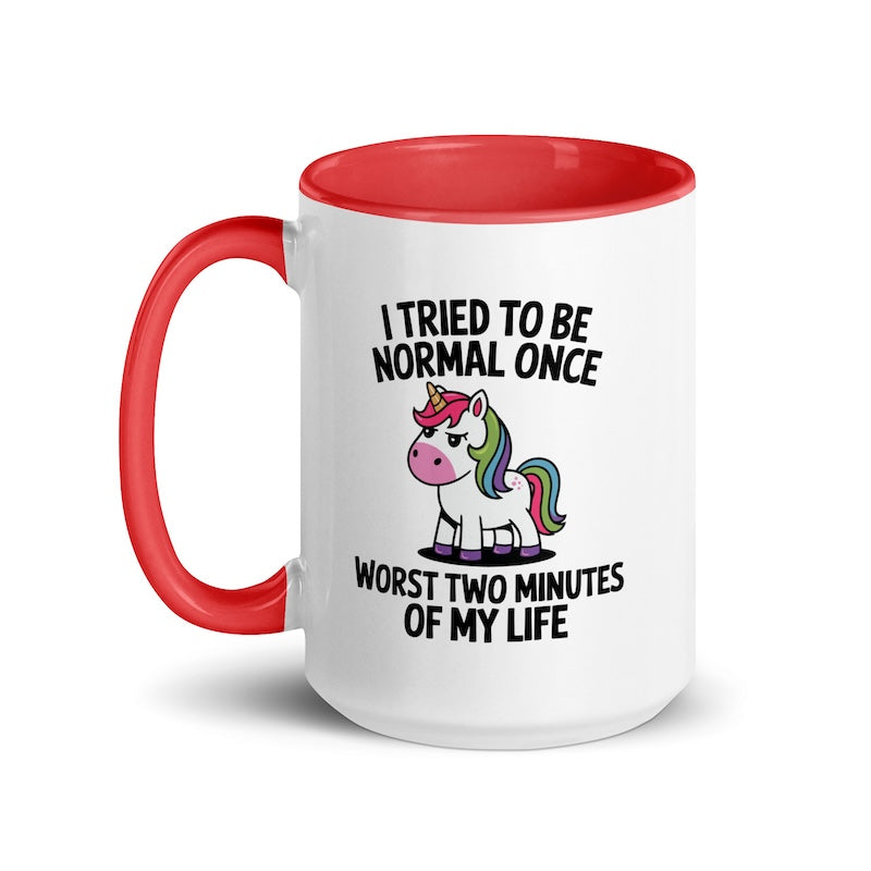 Mug with red interior and handle, featuring a unicorn graphic and text on a white background