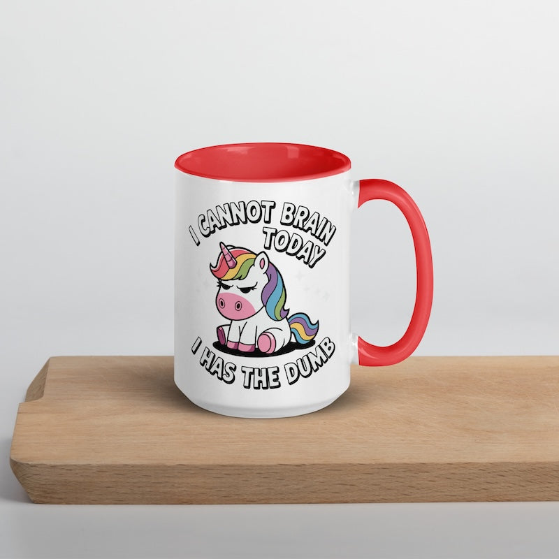 Mug with unicorn design and text on a wooden surface