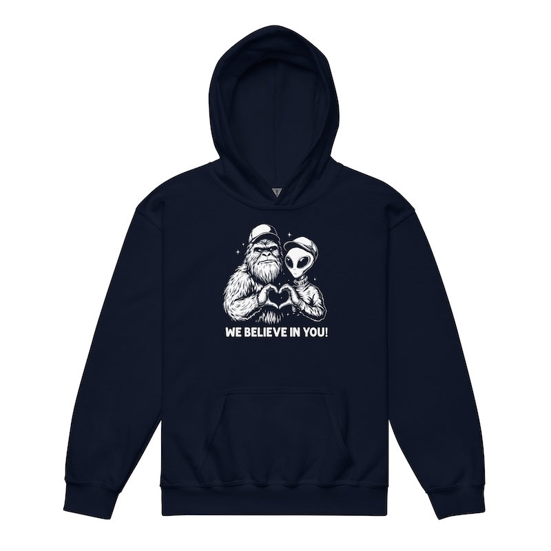 Navy hoodie with a graphic of a man and alien holding hands and 'We Believe In You!' text on a white background