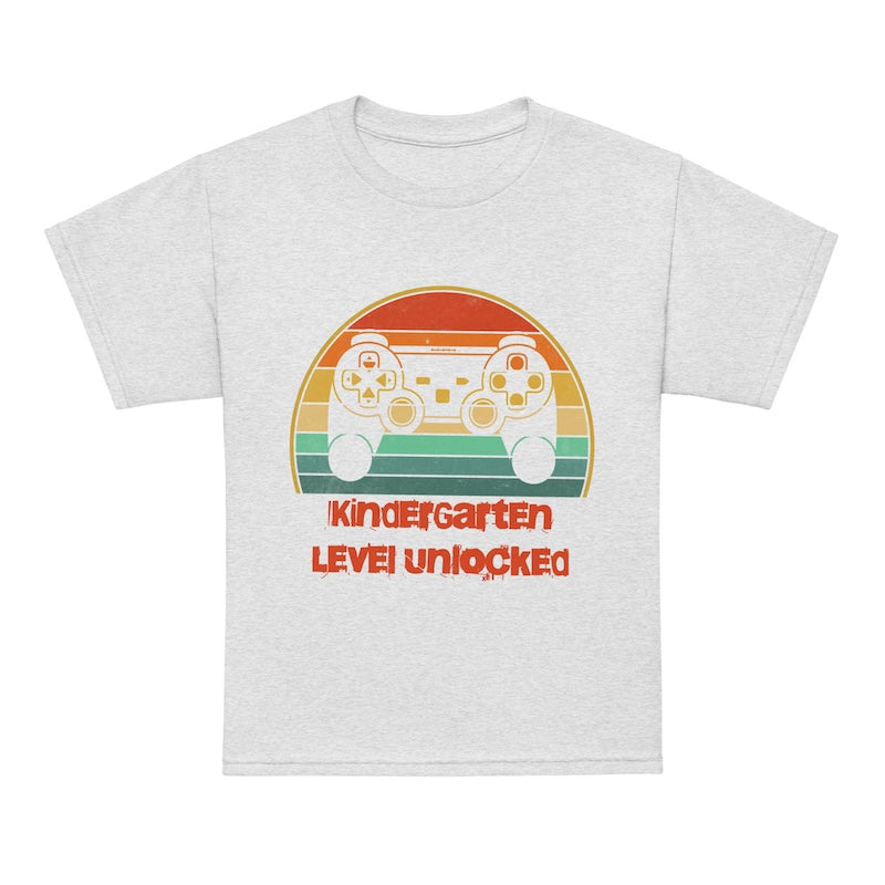 White t-shirt with a colorful graphic and text 'Kindergarten Level Unlocked' on a white background