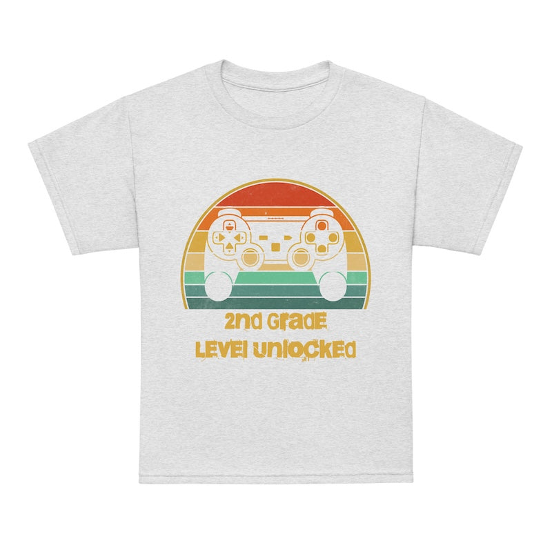 White t-shirt with a retro game controller graphic and text on a white background