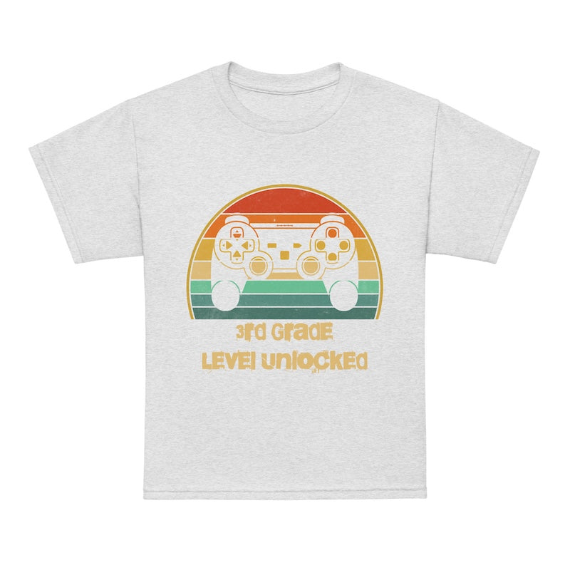White t-shirt with a colorful graphic and '3rd Grade Level Unlocked' text on a white background