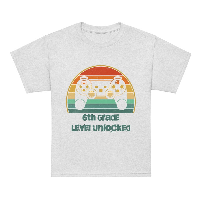 White t-shirt with retro game controller graphic and text on a white background