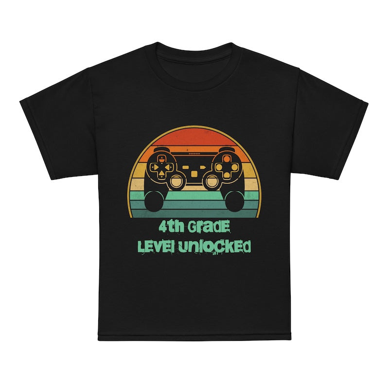 Black t-shirt with a colorful gaming controller graphic and '4th Grade Level Unlocked' text on a white background