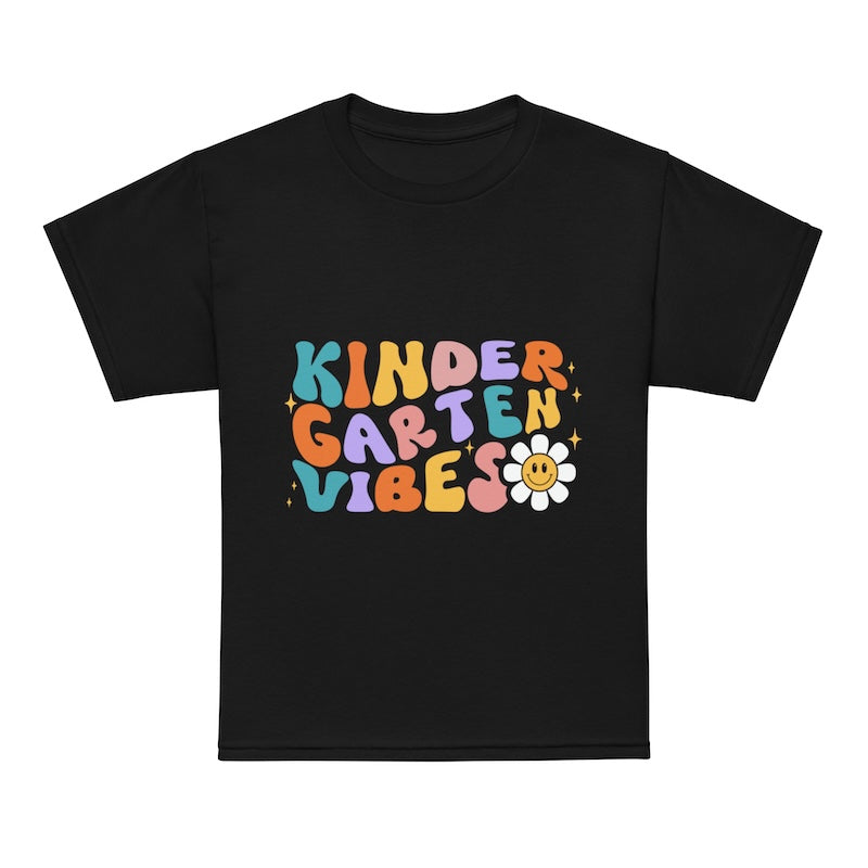 Black t-shirt with colorful 'Kinder Garten Vibes' text and a flower graphic on a white background