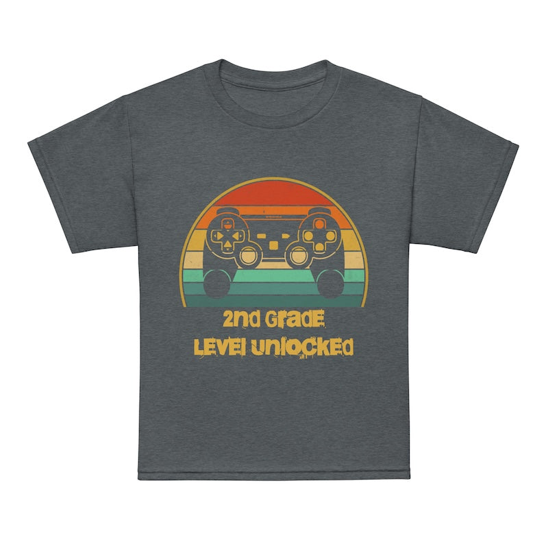 Gray t-shirt with a colorful graphic and text '2nd Grade Level Unlocked' on a white background