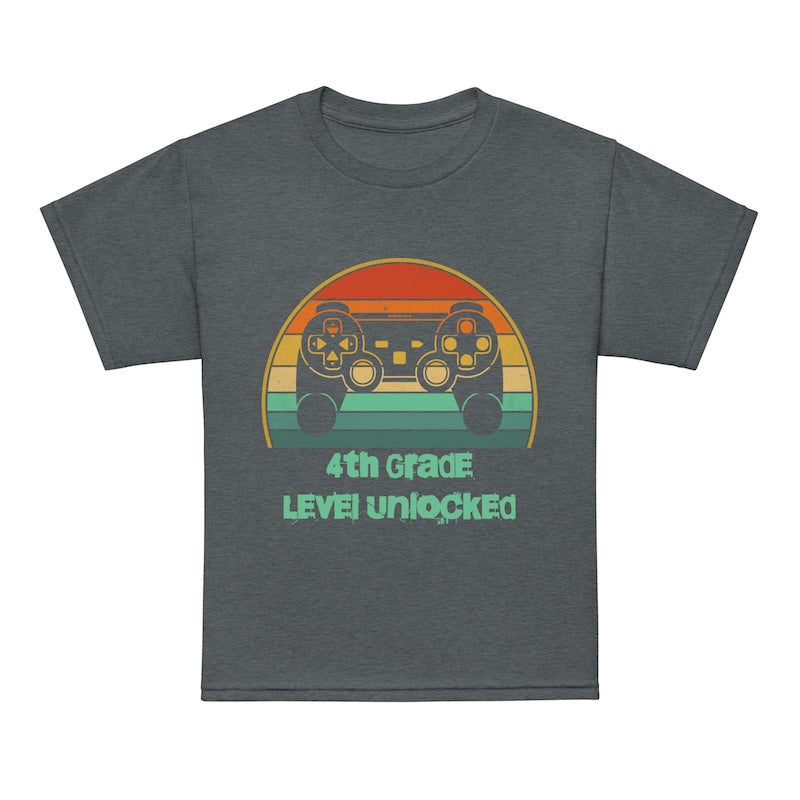 Gray t-shirt with a colorful graphic and text '4th Grade Level Unlocked' on a white background