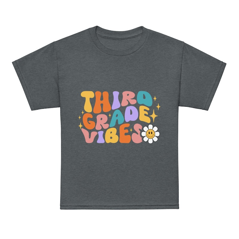 Gray t-shirt with colorful 'Third Grade Vibes' text and a flower graphic on a white background